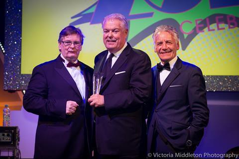 Don McCarthy (centre) is presented the Retail Legends Award by Richard Boland and Jeff Banks